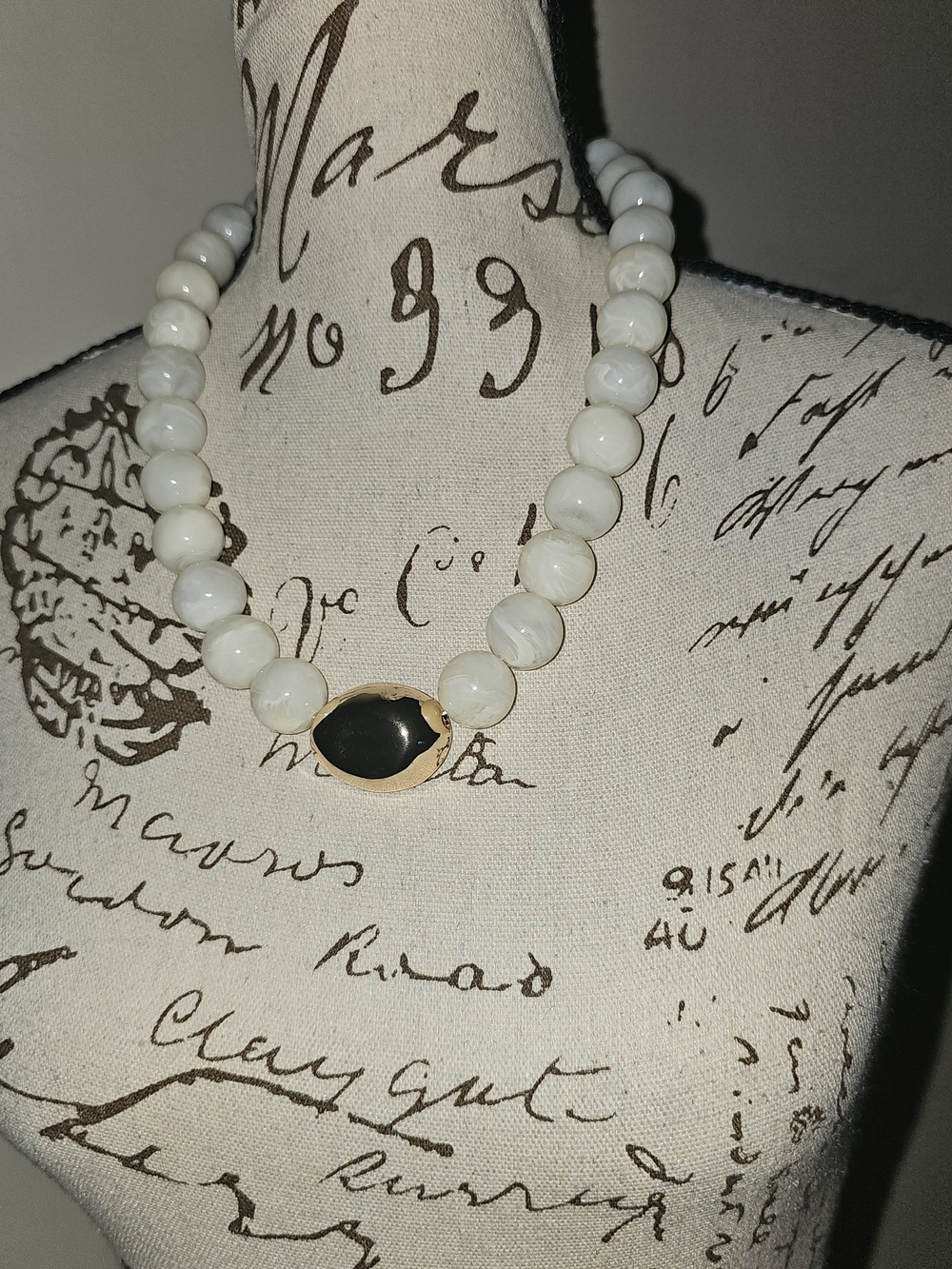 White Beaded Necklace with Black Stone Accent